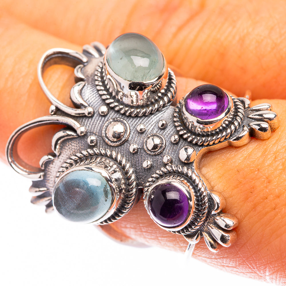 Ornate sterling silver ring with aquamarine and amethyst cabochon gemstones