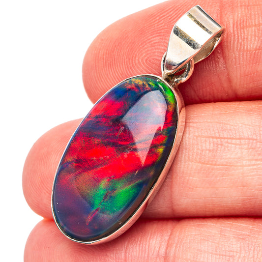 Sterling silver opal pendant with oval multicolor stone and top loop bail