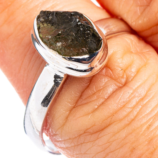 Sterling silver moldavite ring with irregular dark green stone bezel