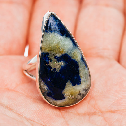 Sterling silver ring with teardrop blue stone, marbled matrix, slim band