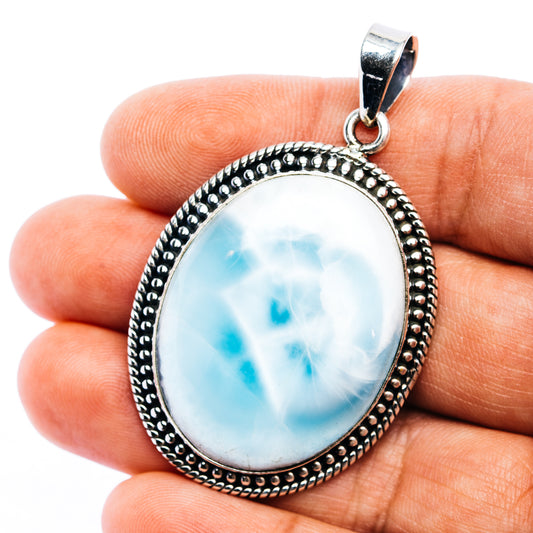 Oval larimar pendant with blue marbled stone, .925 sterling silver bezel and bail