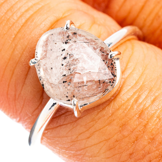 Sterling silver ring with faceted cacoxenite-style stone, pear-shaped bezel