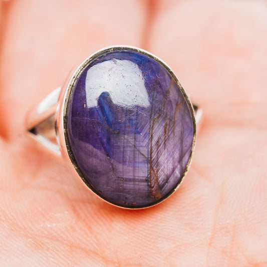 Sterling silver oval cabochon ring with purple-blue stone, side view
