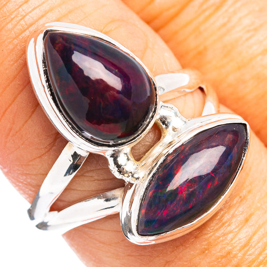 Sterling silver opal ring with two teardrop black opal stones, open prong setting