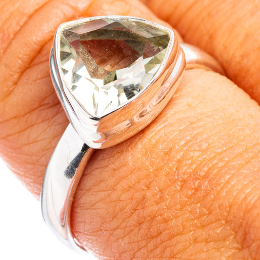 Sterling silver ring with faceted pear-shaped gemstone, close-up on band and setting