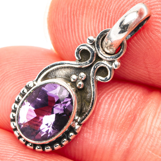 Sterling silver amethyst pendant with oval purple gemstone, ornate bezel and side loops