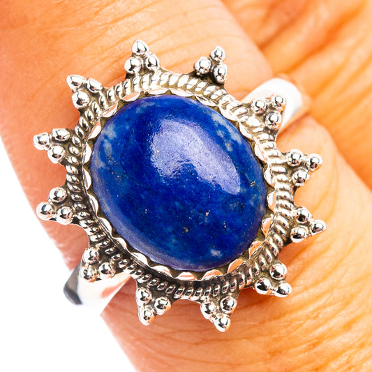 Sterling silver ring with oval lapis lazuli cabochon and ball-accented bezel