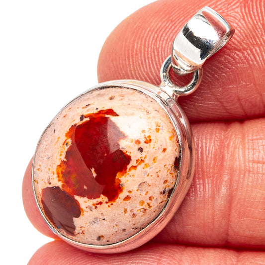 Sterling silver fire opal pendant with oval cabochon red-and-orange gemstone