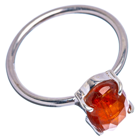 Sterling silver ring with orange-red faceted gemstone in square prong bezel, side view
