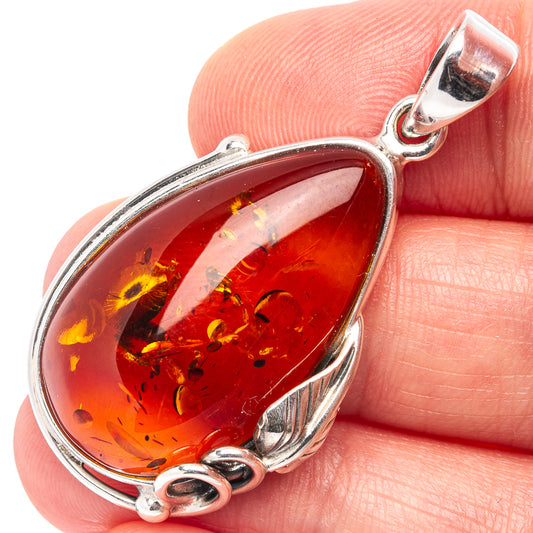 Amber leaf pendant in .925 sterling silver with red teardrop Baltic amber