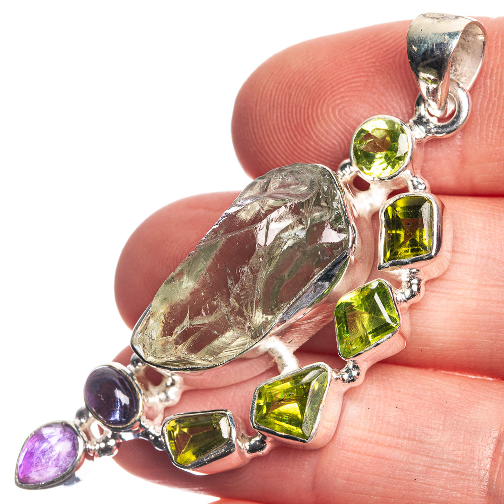 Sterling silver pendant with rough aquamarine, green peridot and purple amethyst stones