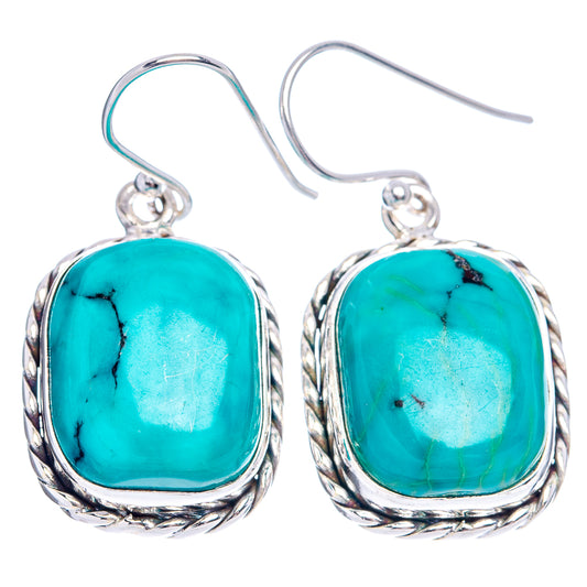 Turquoise cabochon drop earrings in silver bezel with fishhook backs, pair view