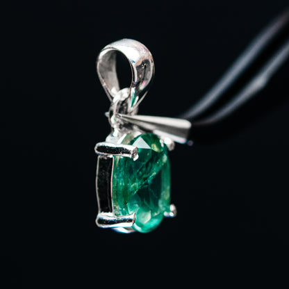 Sterling silver pendant with faceted green gemstone in side prong frame