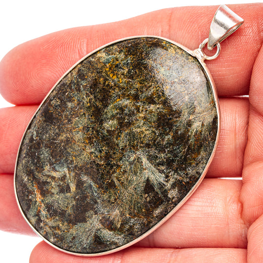 Silver-plated oval palm stone pendant with dark mottled stone and top bail loop