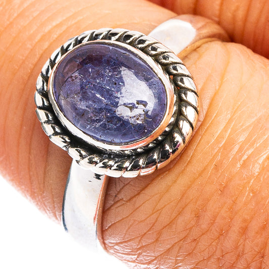 Sterling silver tanzanite ring with oval blue-purple gemstone and braided bezel