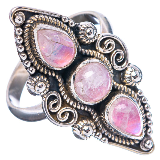 Sterling silver ring with three pink teardrop stones, scroll accents, and open side view