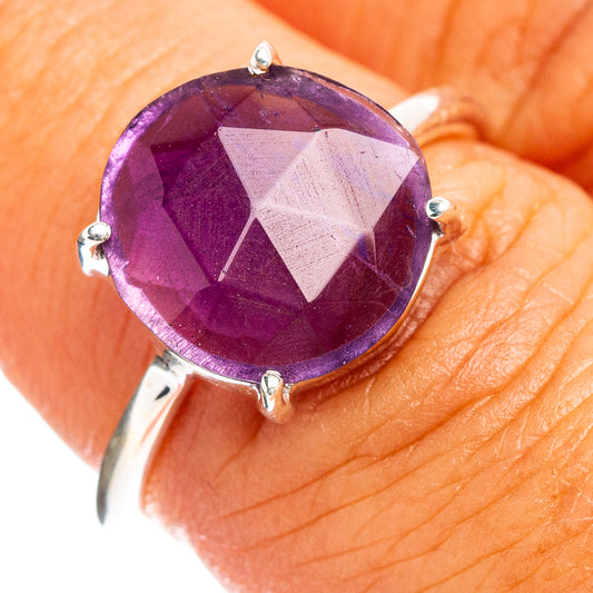 Amethyst faceted ring with oval purple gemstone and silver prong setting