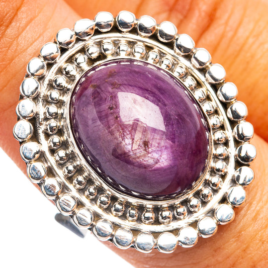 Sterling silver oval star ruby ring with beaded halo and prong-set gemstone