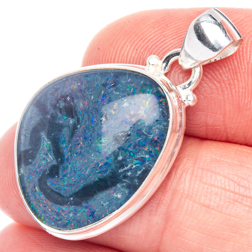 Oval blue opal pendant in sterling silver with bail and bezel setting