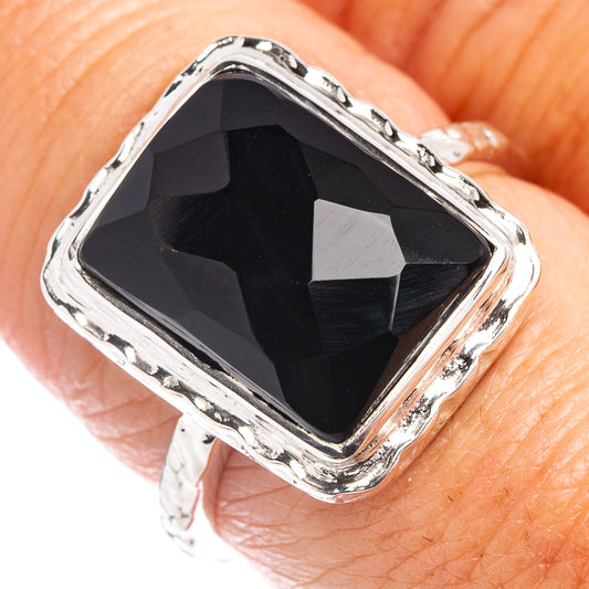 Sterling silver ring with square black onyx bezel and faceted dark stone