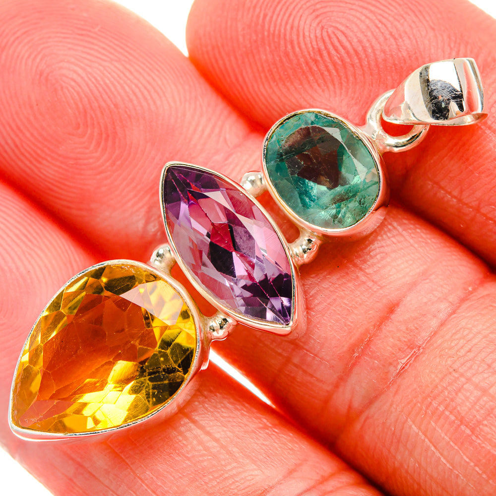 Sterling silver pendant with faceted orange, purple, and green teardrop gems