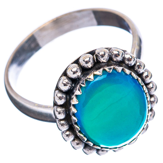 Sterling silver opal ring with oval blue-green cabochon and beaded border