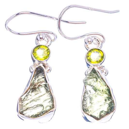 Sterling silver drop earrings with peridot-green round stones and irregular metallic green charms