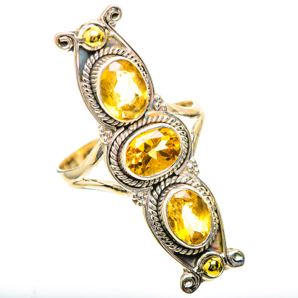 Silver citrine ring with three oval bezel-set stones and detailed twisted borders