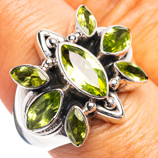 Sterling silver peridot gemstone ring, cluster of oval and marquise green stones, on hand