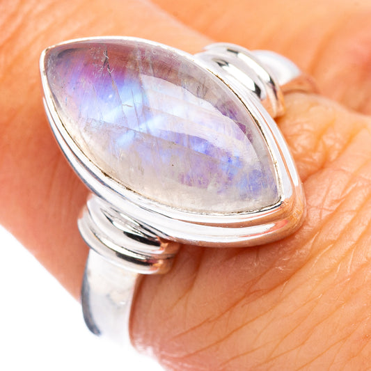 Sterling silver ring with oval rainbow moonstone cabochon, high-shine bezel setting