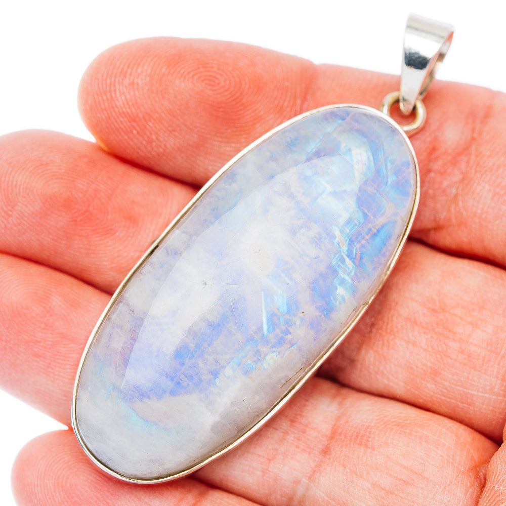 Sterling silver rainbow moonstone pendant with oval blue opalescent stone and top bail