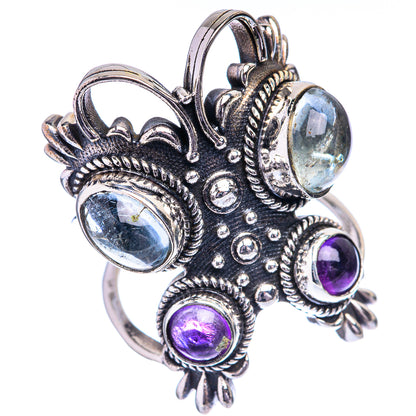 Ornate sterling silver ring, side view, showing light-blue and purple round stones in bezels.