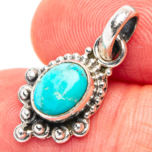 Turquoise oval pendant in .925 sterling silver with ornate bead edge and bail loop