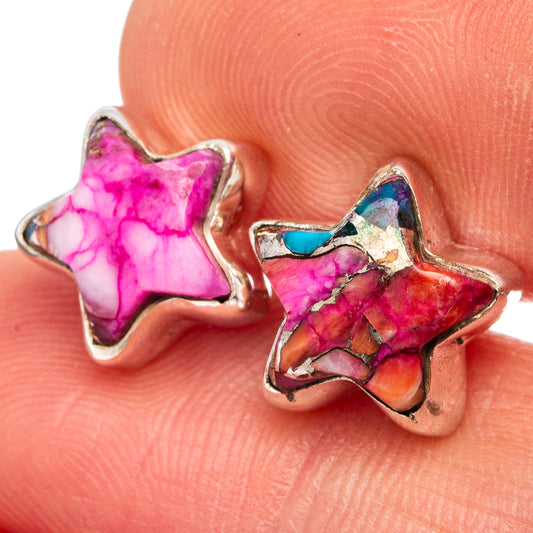 Pink and turquoise star stud earrings, .925 sterling silver, close-up on hand