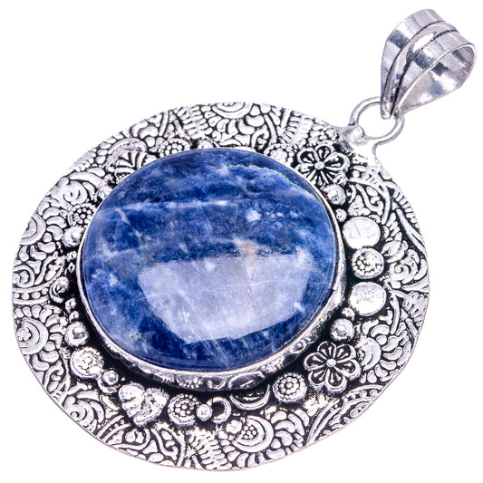 German silver sodalite pendant, round blue cabochon with detailed embossed border