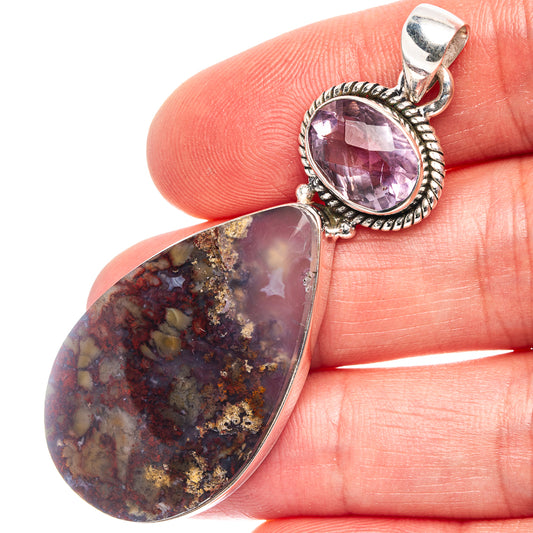 Close-up 925 sterling silver pendant with amethyst round and plume agate drop