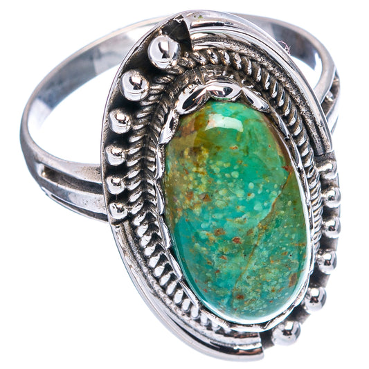Silver statement ring featuring an oval turquoise cabochon in a decorative bezel mount