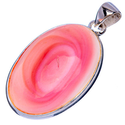 Conch pendant in oval pink shell with swirling pattern, set in sterling silver bezel