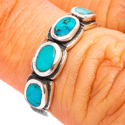 Turquoise inlay sterling silver ring with three oval cabochon stones on hand