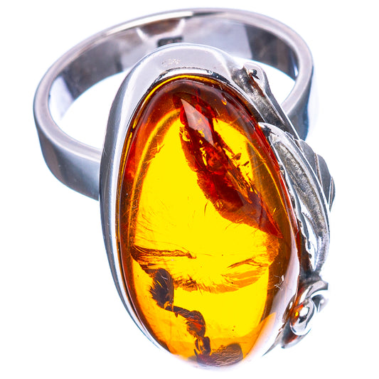 Sterling silver ring with oval amber stone, warm yellow honey color in bezel