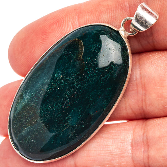 Silver-plated bloodstone pendant with dark green oval stone and round bail cap