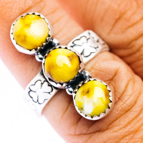Sterling silver ring with three round yellow cabochon stones and floral cutouts