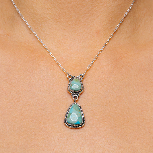 Sterling silver necklace with two turquoise teardrop pendants and link chain