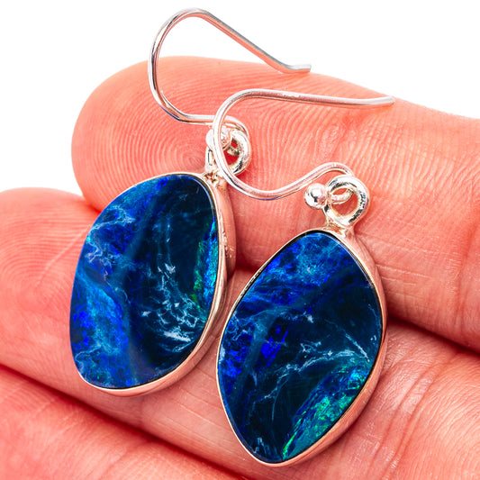 Sterling silver teardrop opal earrings with vivid blue iridescent stones, red-backed centers