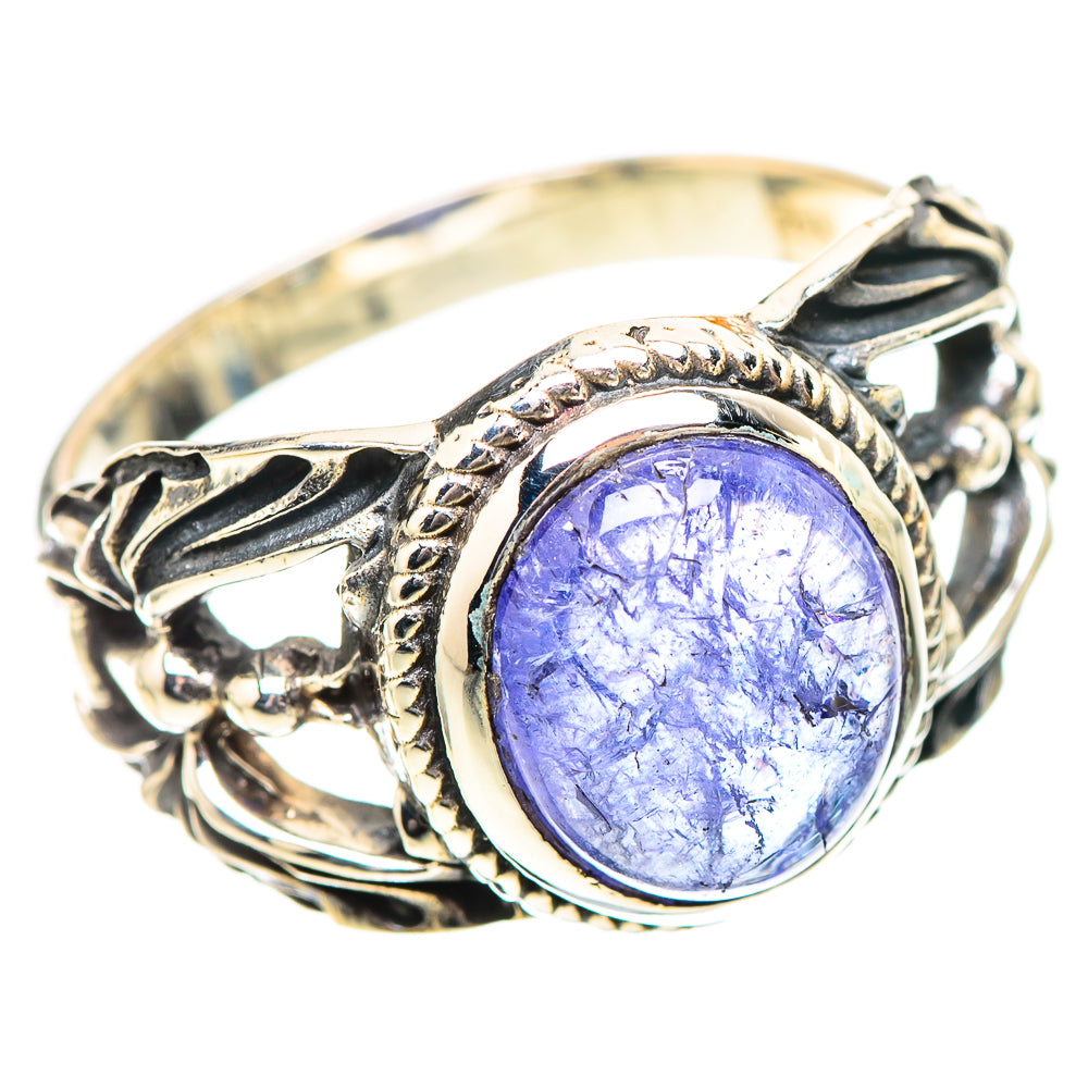 Sterling silver ring with oval light blue gemstone, detailed filigree bezel setting