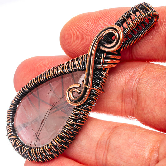 Rutilated quartz teardrop pendant detail, oxidized copper wire wrap and bail