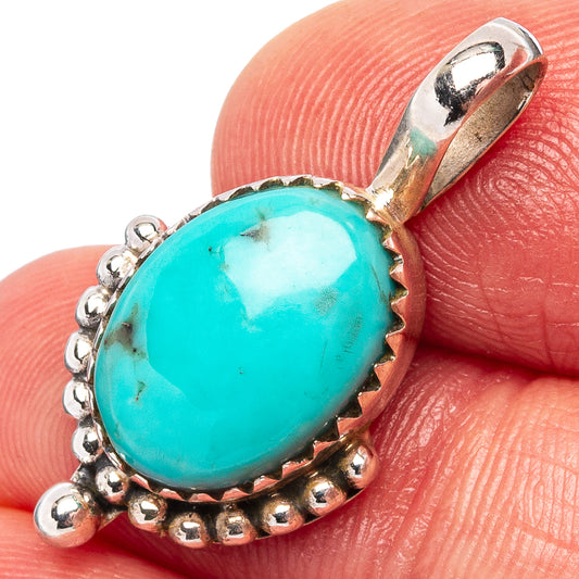 Sterling silver turquoise pendant with oval cabochon and beaded halo border