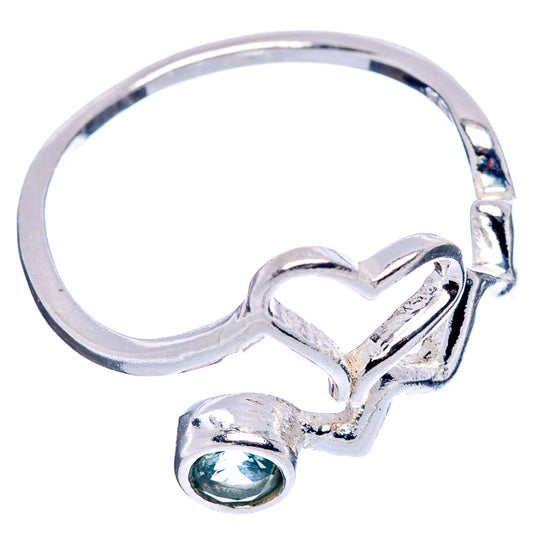 Sterling silver ring with heart-shaped openwork top and round blue gemstone bezel