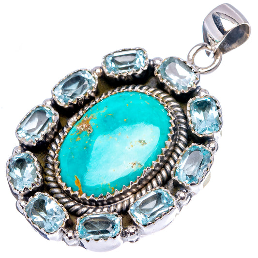 Silver pendant with oval turquoise center and blue topaz side stones, openwork halo.