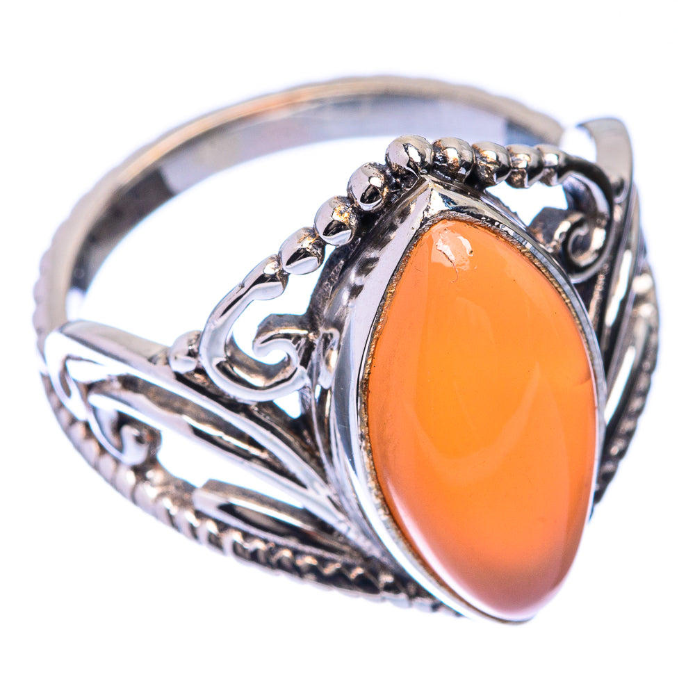 Sterling silver oval peach moonstone ring with side filigree and raised bezel